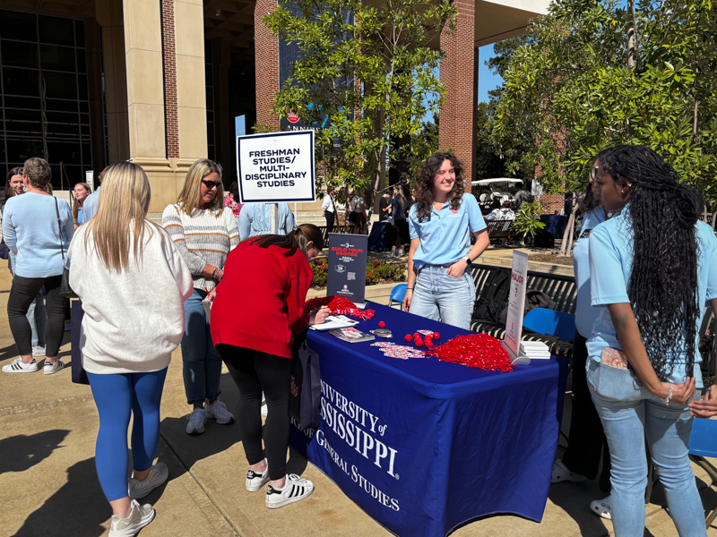 Freshman Studies and MDS ambassadors table in front of the Ole Miss student union. 