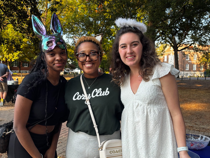 General Studies staff member and MDS Student Ambassadors smile at a campus recruiting event. 